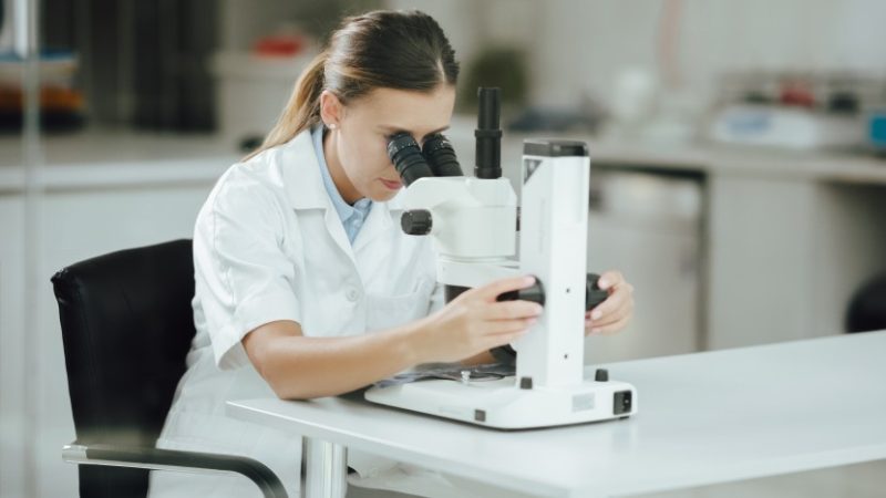 scientist-analyzing-science-experiment-laboratory-test-looking-at-microscope-laboratory-research_t20_A9Za71